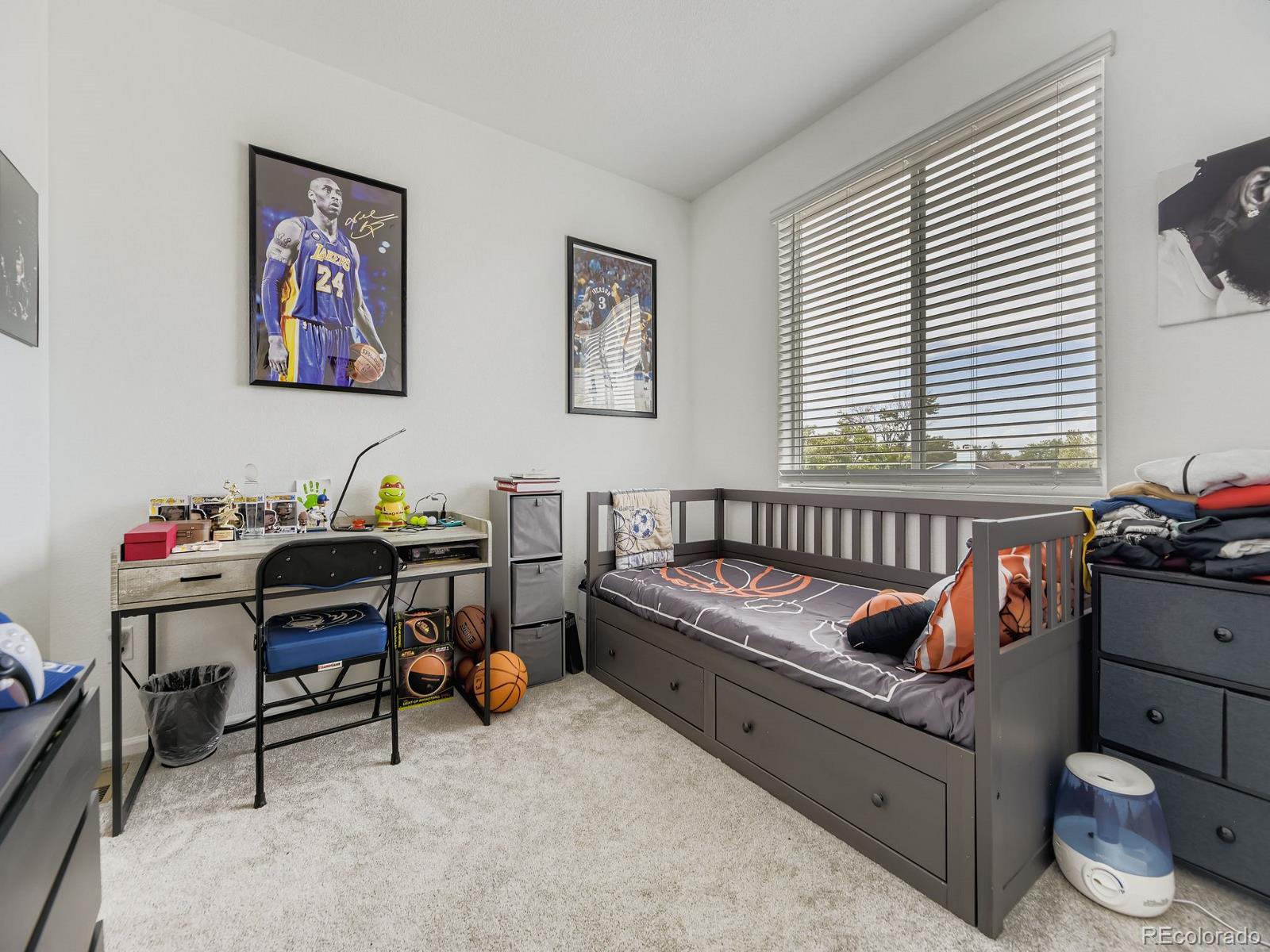 1680 South Tower Road Aurora, CO 80017 - Photo 23 of 26 a bedroom with furniture and a window