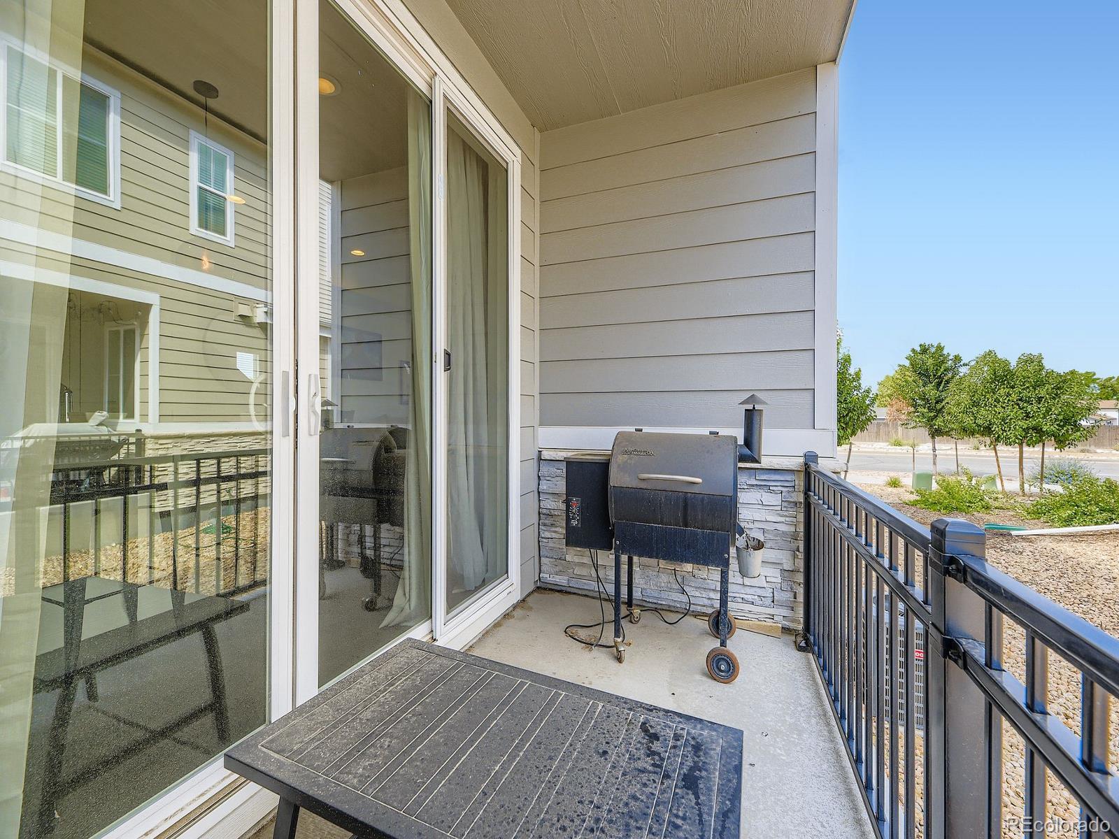 1680 South Tower Road Aurora, CO 80017 - Photo 26 of 26 a balcony with table and chairs