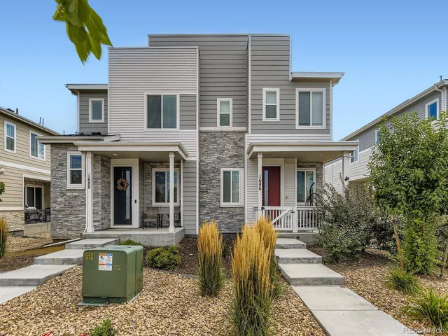 a front view of a house with many windows