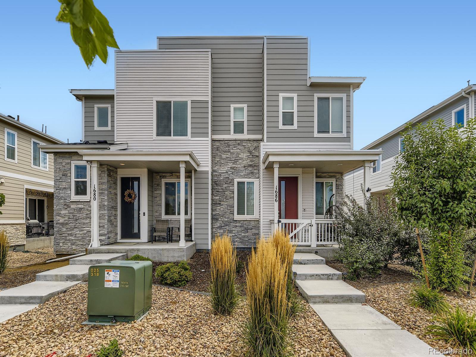1680 South Tower Road Aurora, CO 80017 - Photo 3 of 26 a front view of a house with many windows