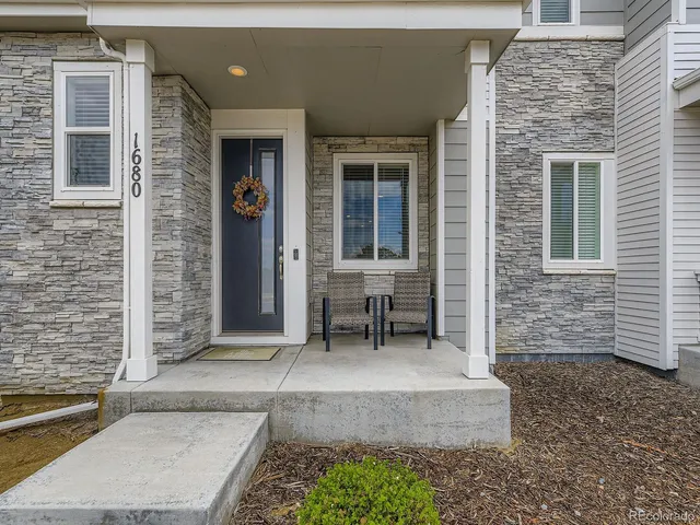 a bench sitting in front of a house