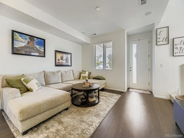 a living room with large couches and view of living room
