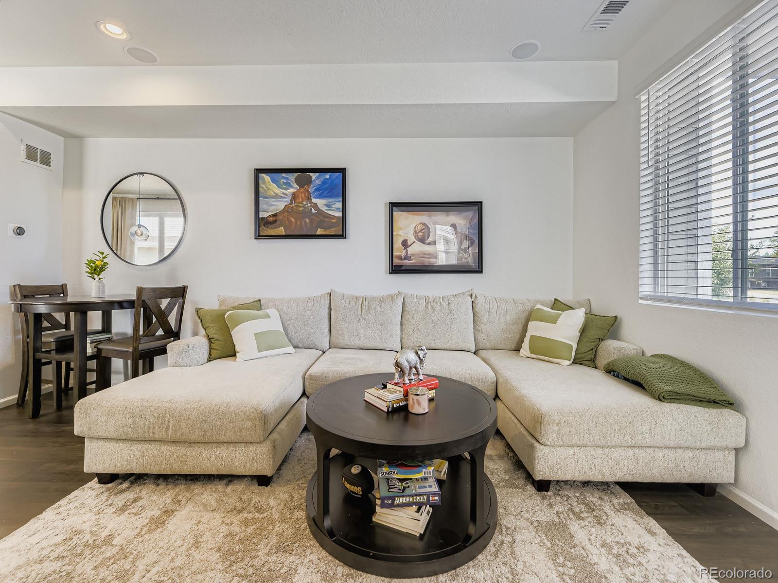 1680 South Tower Road Aurora, CO 80017 - Photo 8 of 26 a living room with furniture and a wall
