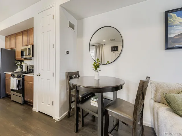 a view of a livingroom with furniture and a mirror
