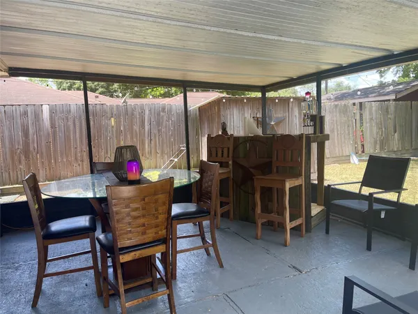 a view of a tables and chairs in patio