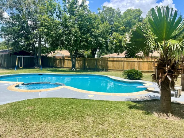 a view of a playground with a swimming pool