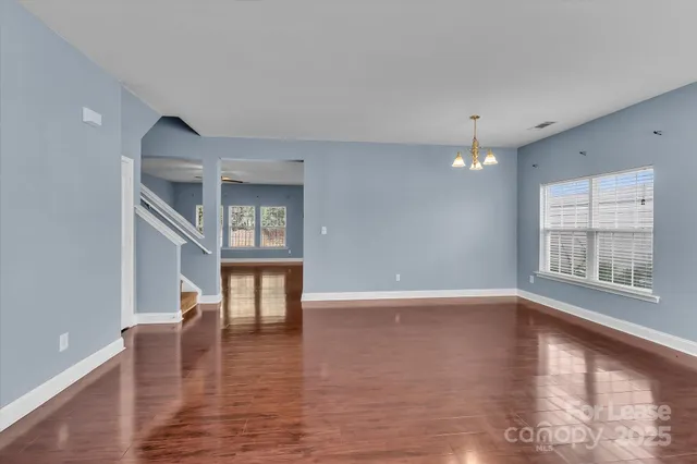 a view of an entryway with wooden floor and a window