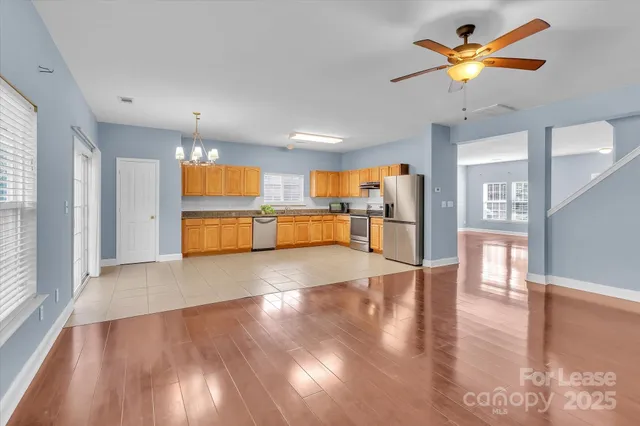 a view of a kitchen with a sink and microwave