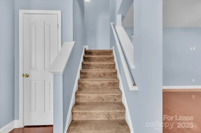a view of staircase with white walls and white walls