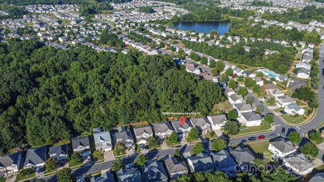 an aerial view of a houses with outdoor space and street view