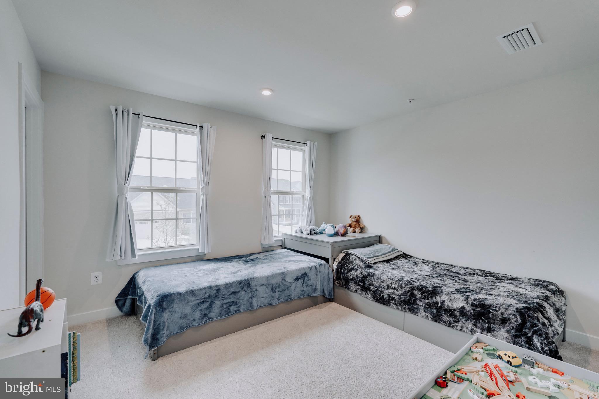 9004 Cavesson Way Upper Marlboro, MD 20772 - Photo 18 of 60 a bedroom with two beds and a window