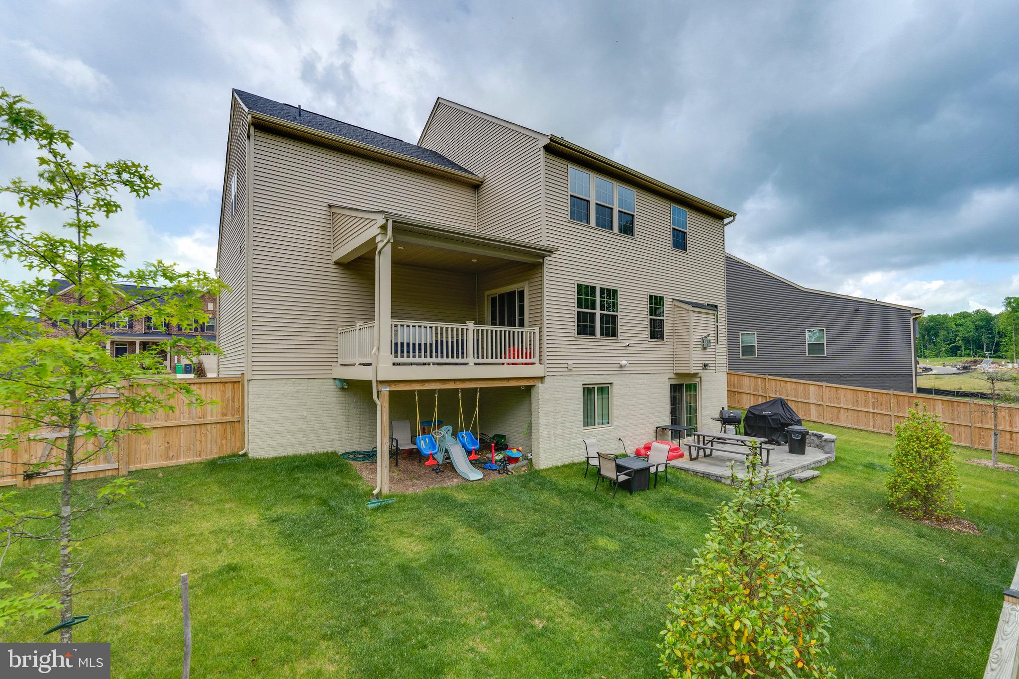 9004 Cavesson Way Upper Marlboro, MD 20772 - Photo 20 of 60 a view of an house with backyard space and deck