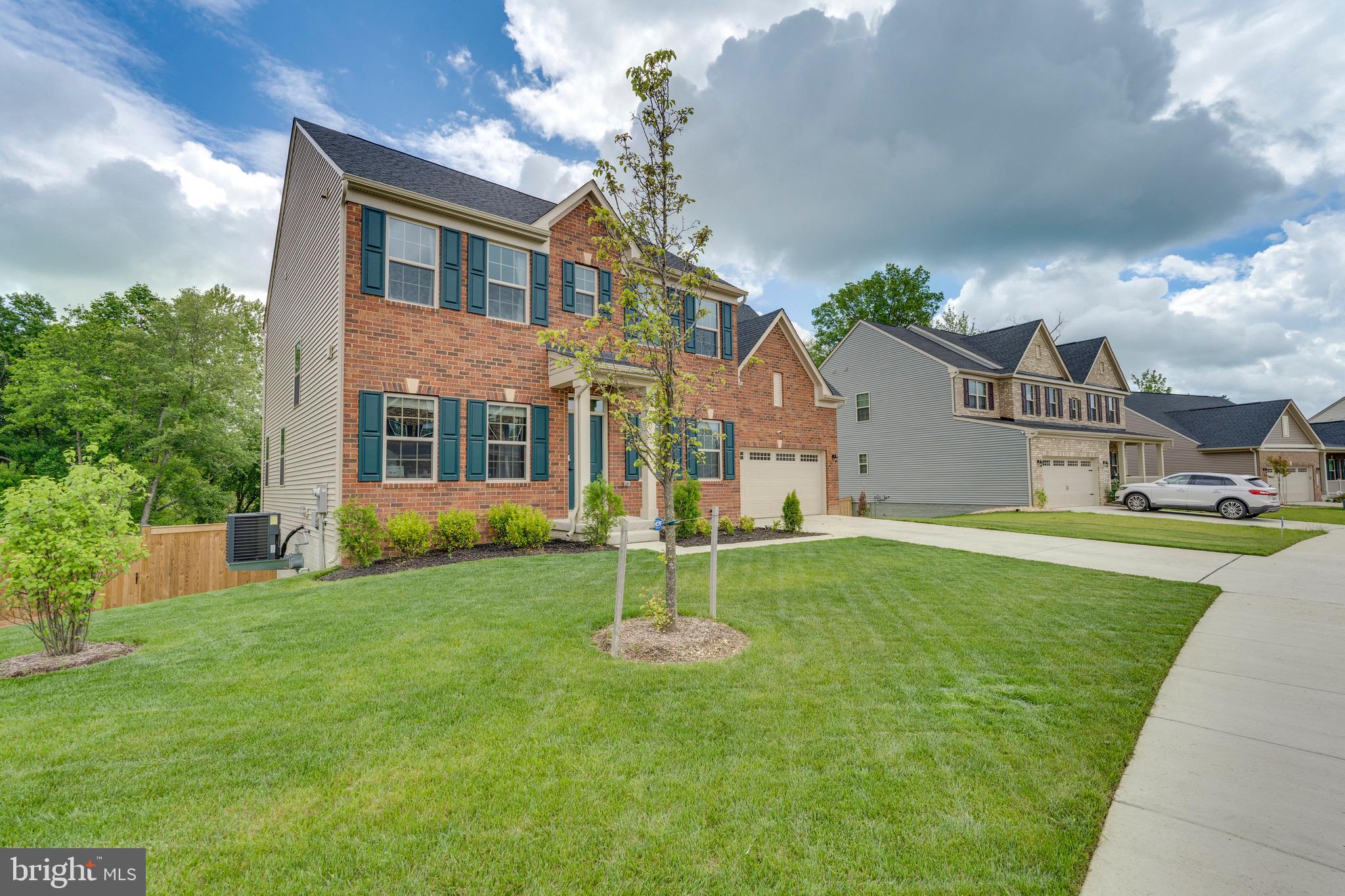 9004 Cavesson Way Upper Marlboro, MD 20772 - Photo 2 of 60 a house view with a garden space