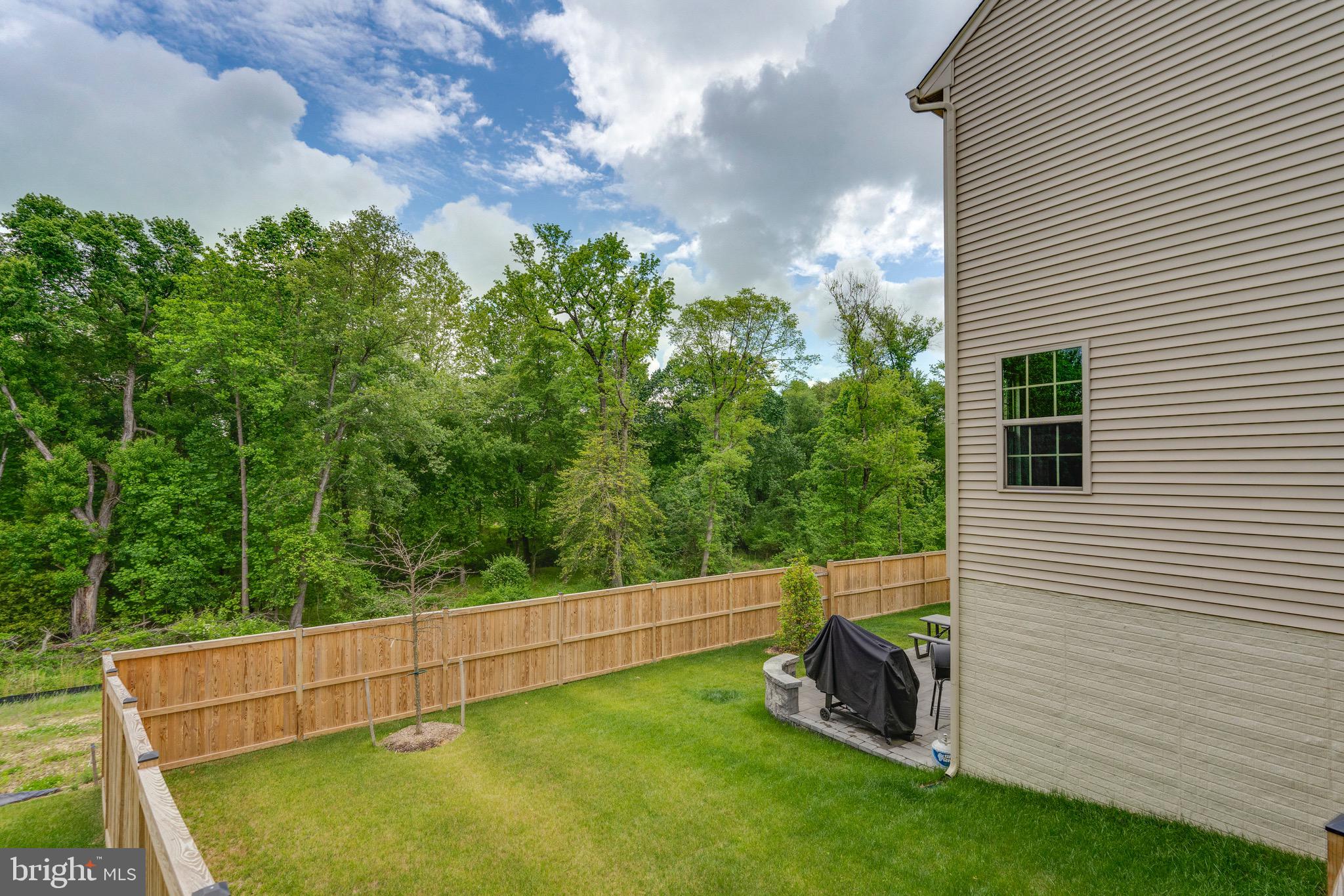 9004 Cavesson Way Upper Marlboro, MD 20772 - Photo 26 of 60 a view of a backyard with plants and a garden