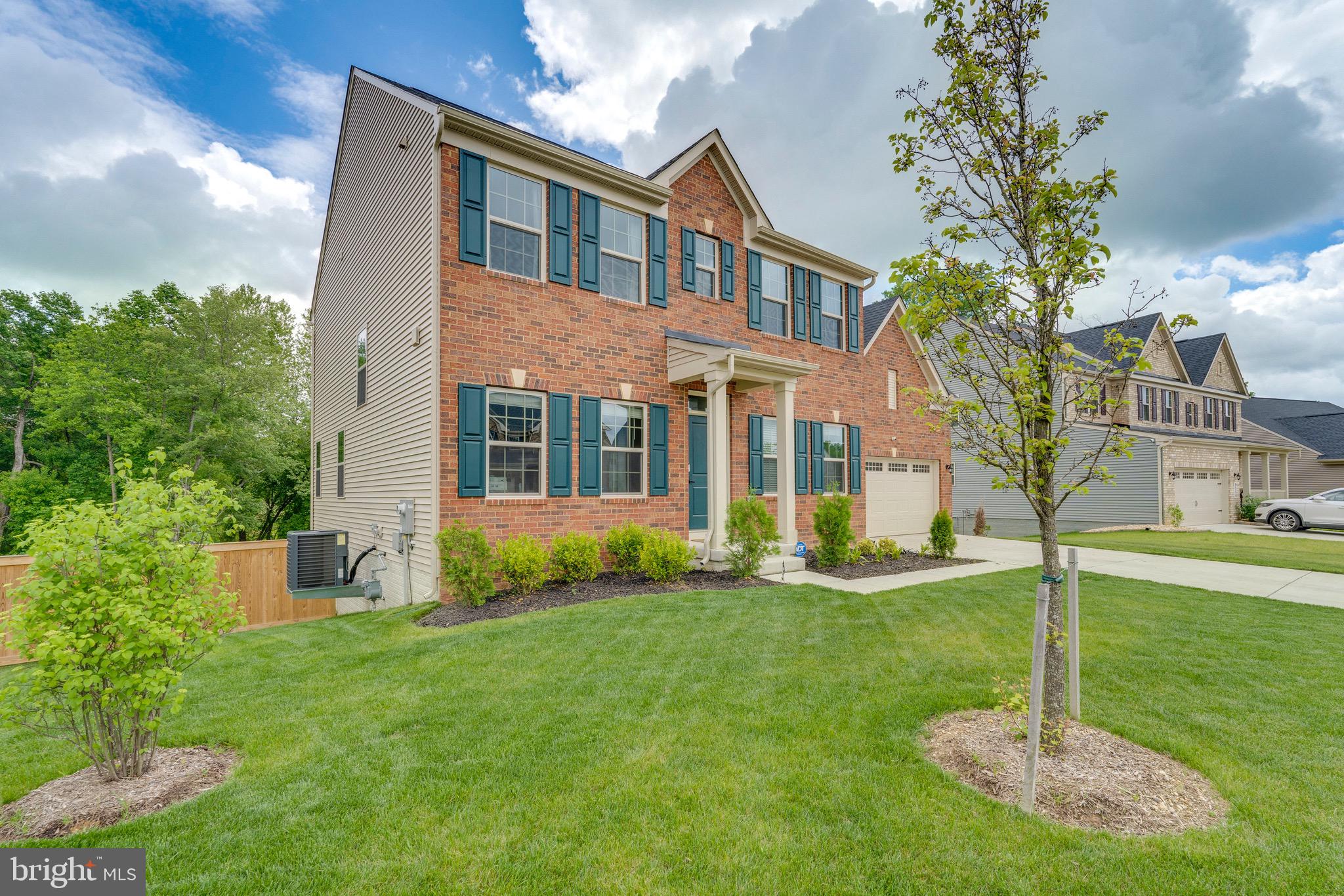 9004 Cavesson Way Upper Marlboro, MD 20772 - Photo 29 of 60 a front view of a house with a yard