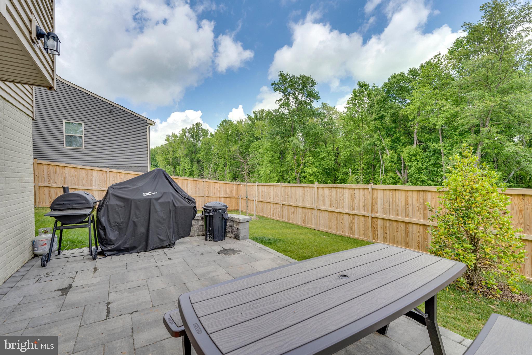 9004 Cavesson Way Upper Marlboro, MD 20772 - Photo 30 of 60 a view of a wooden chairs and table in the patio