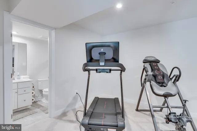 a kitchen with stainless steel appliances granite countertop a stove refrigerator sink and cabinets