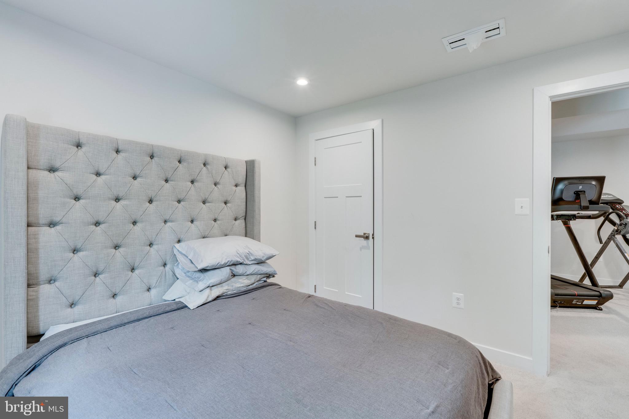 9004 Cavesson Way Upper Marlboro, MD 20772 - Photo 37 of 60 a spacious bedroom with a bed and a shower