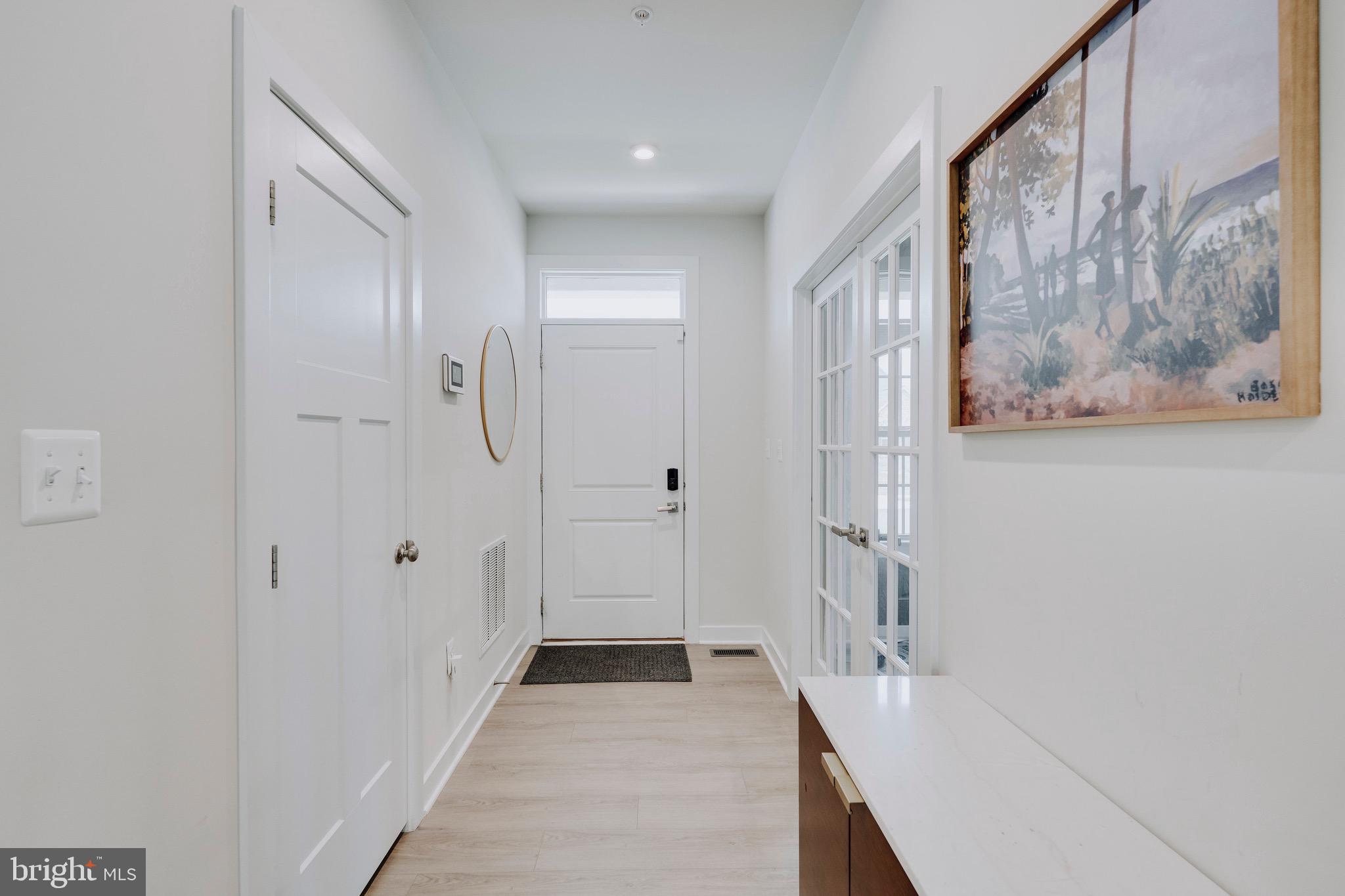 9004 Cavesson Way Upper Marlboro, MD 20772 - Photo 53 of 60 a view of a hallway with wooden floor and closet