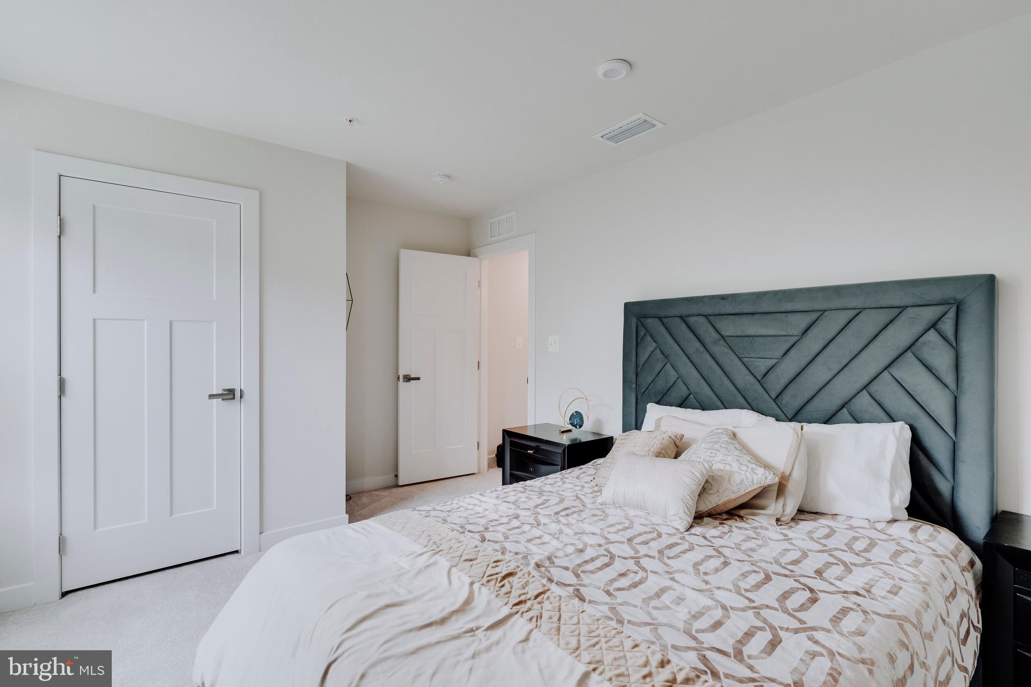 9004 Cavesson Way Upper Marlboro, MD 20772 - Photo 55 of 60 a bed room with a bed and a couch