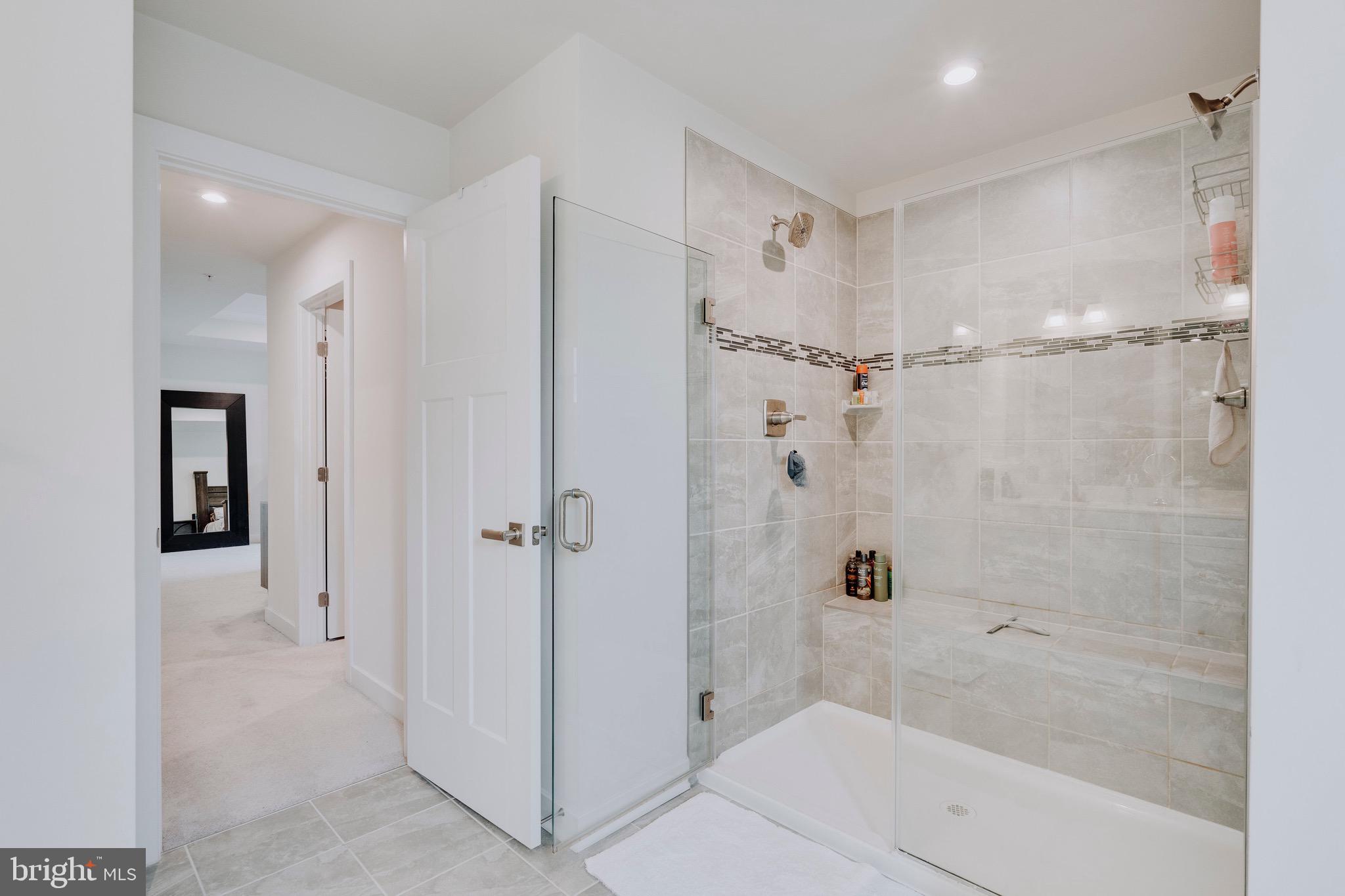 9004 Cavesson Way Upper Marlboro, MD 20772 - Photo 57 of 60 a bathroom with a shower and a tub