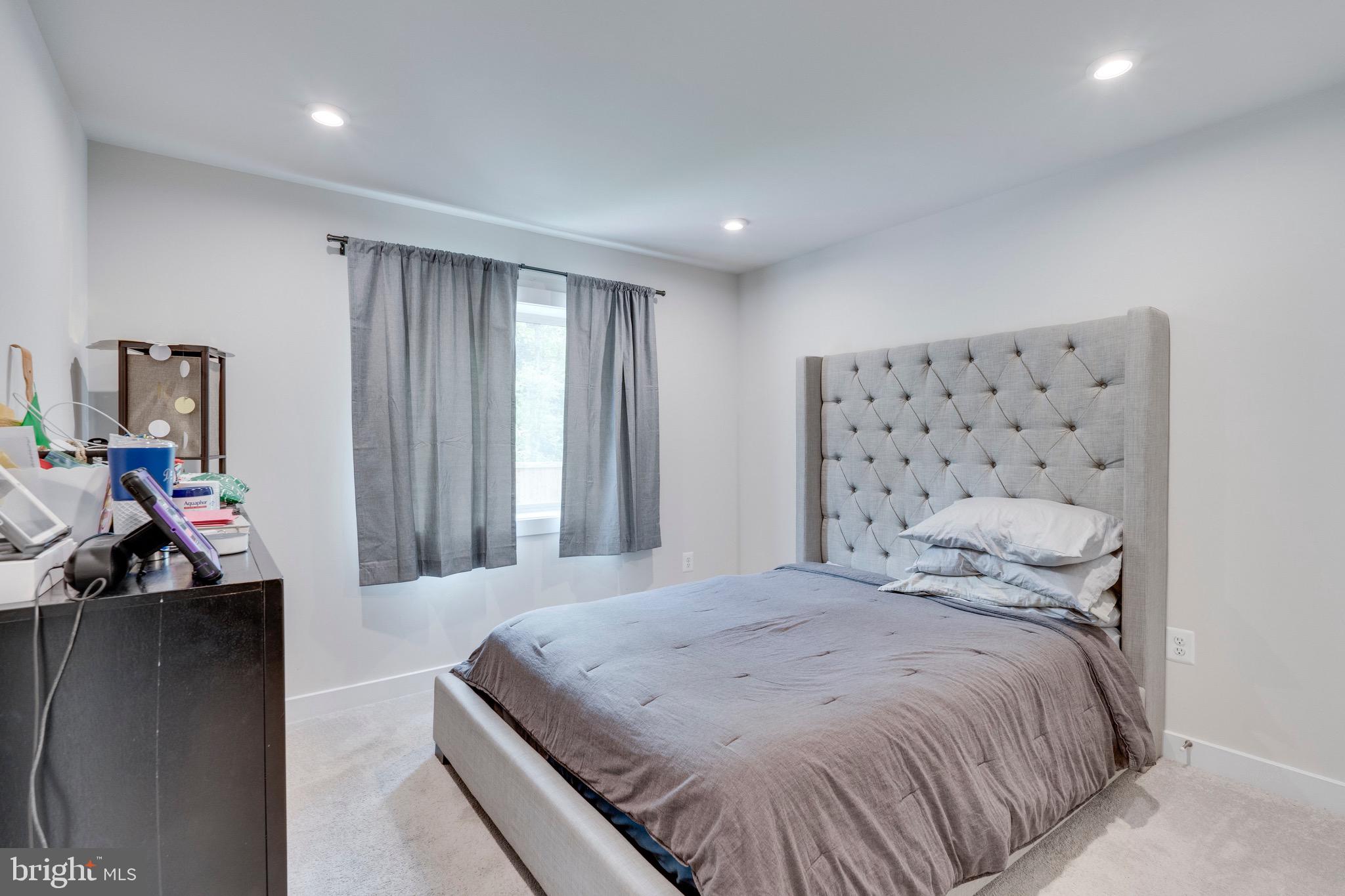 9004 Cavesson Way Upper Marlboro, MD 20772 - Photo 10 of 60 a bedroom with a bed and a painting on the wall