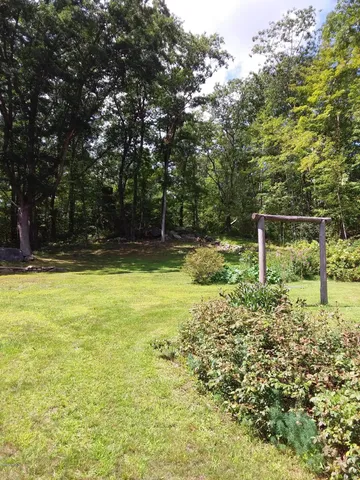 a house view with swimming pool