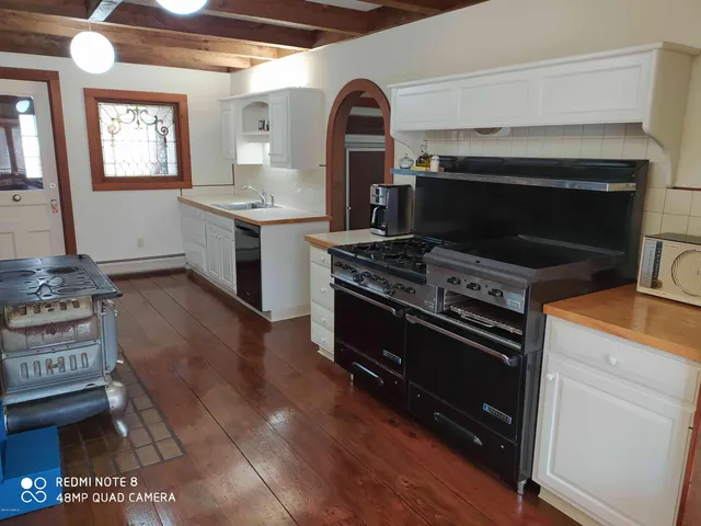 a kitchen with a stove and a microwave