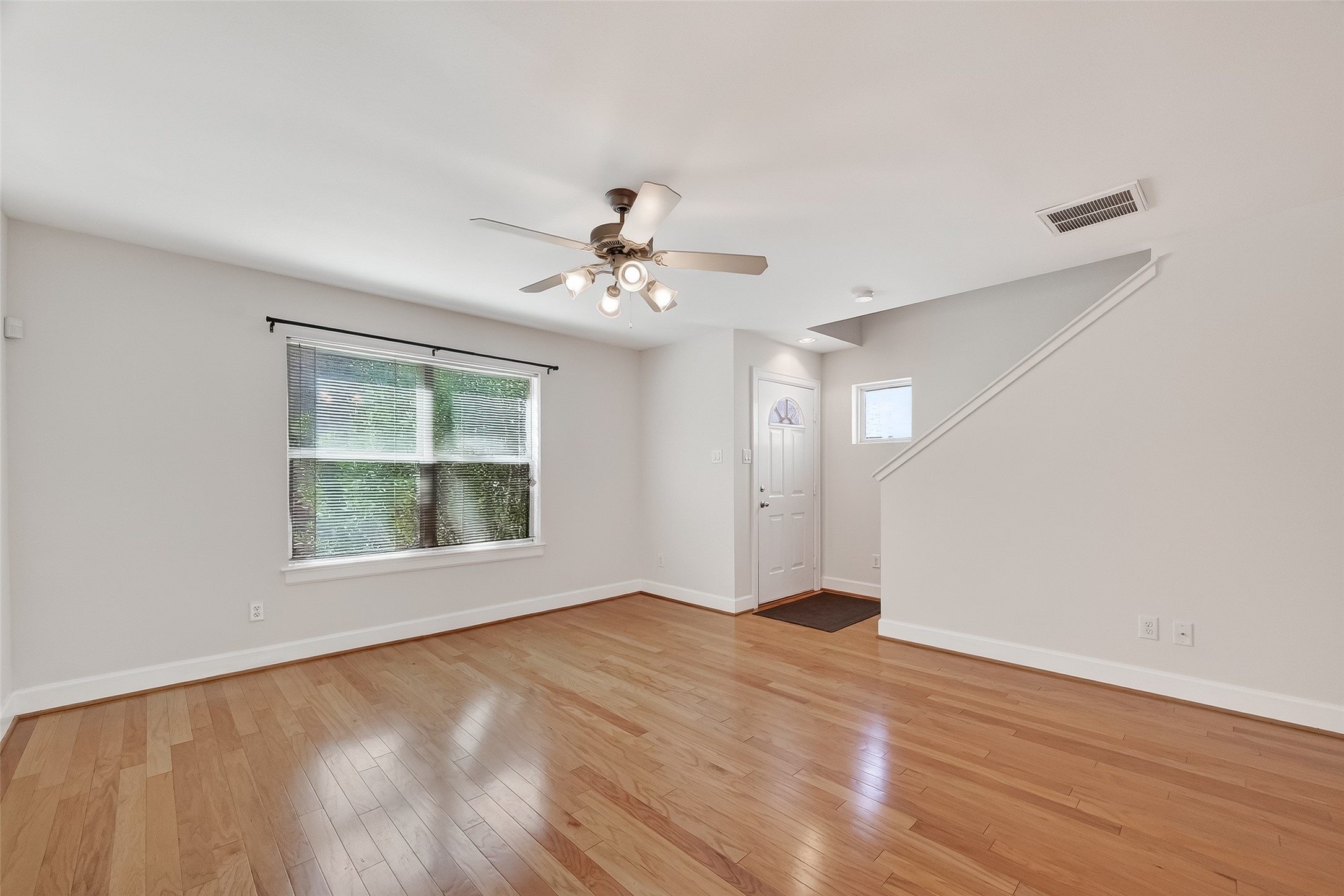 5951 S Loop East, Unit 47 Houston, TX 77033 - Photo 7 of 37 Bright, open living area with hardwood floors is first floor living at it's best. You and your guests step right into the living area.