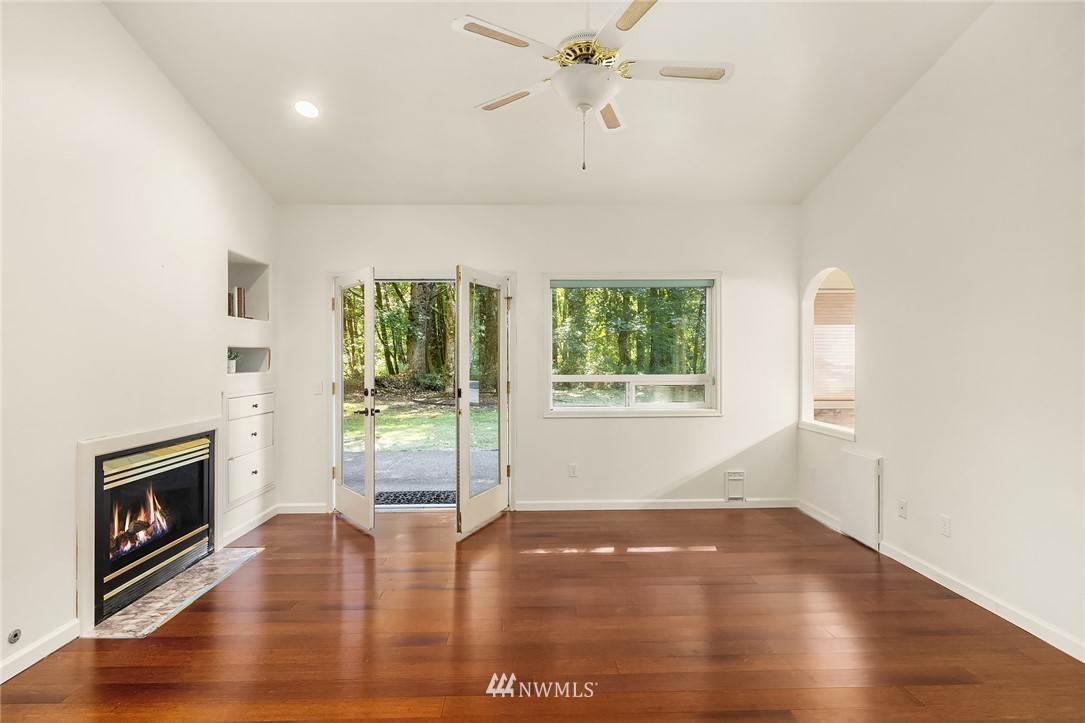 16425 Southeast Jones Road Renton, WA 98058 - Photo 14 of 40 a view of an empty room with window and wooden floor