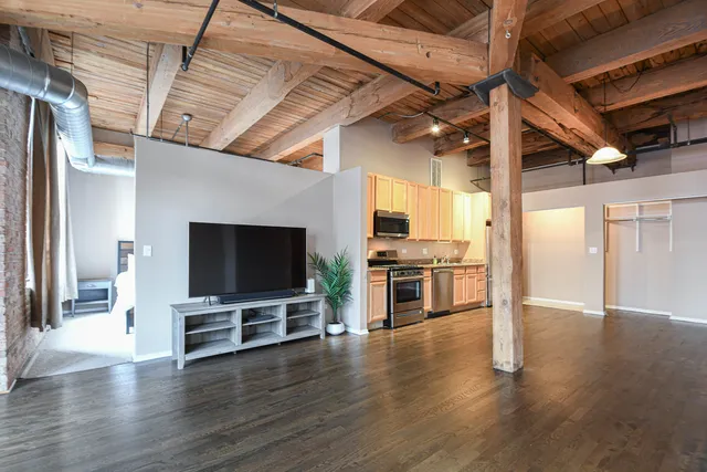 a view of kitchen with furniture and wooden floor