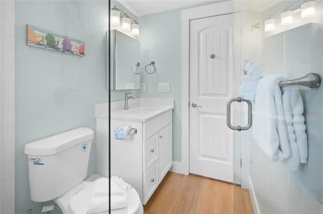 a spacious bathroom with a granite countertop sink and a mirror