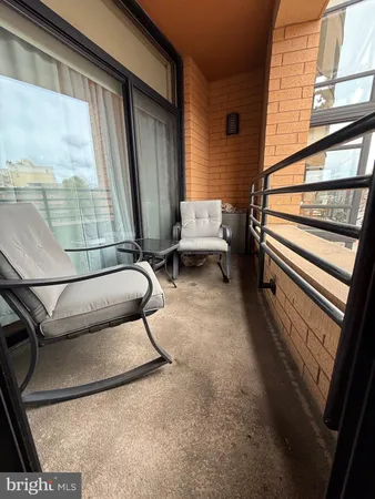 a view of staircase with a rug