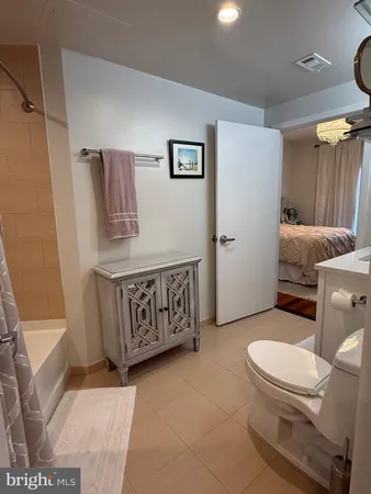 a bathroom with a toilet a sink and a shower