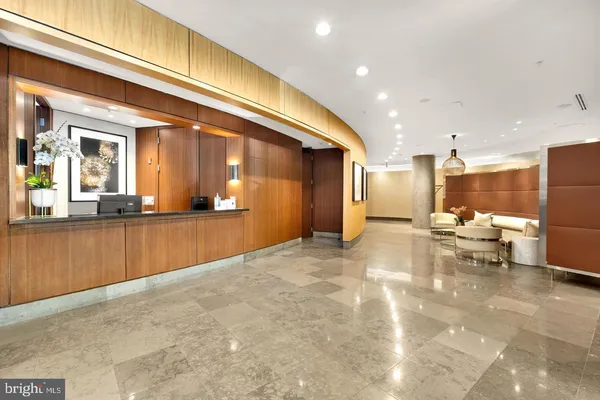 a view of a living room and kitchen view
