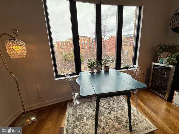 a view of a room with furniture and window