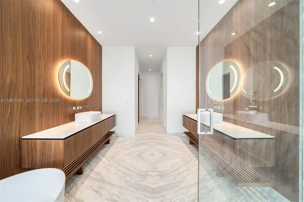 a bathroom with a sink a bathtub and a shower