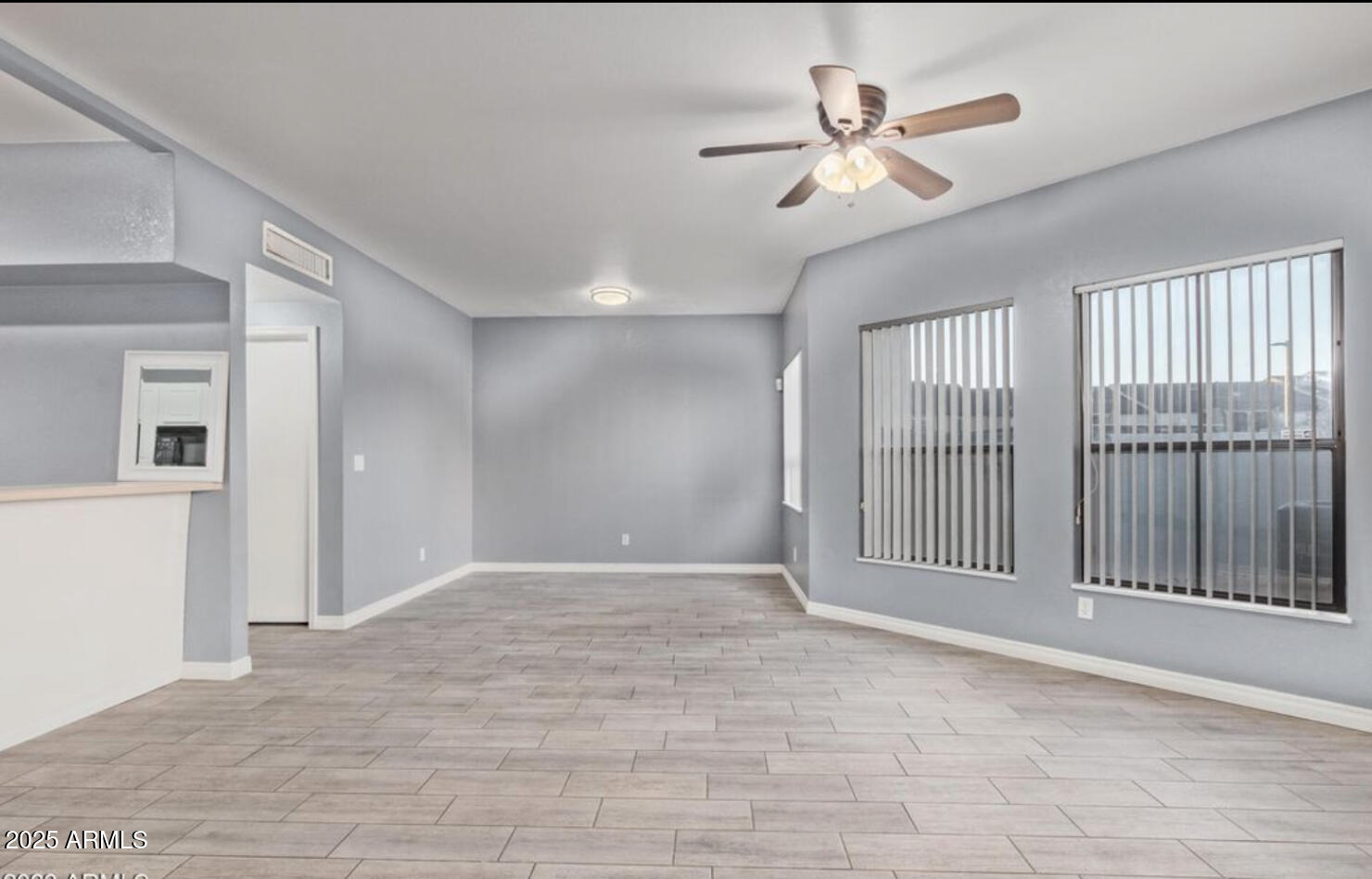 280 South Elizabeth Way, Unit 14 Chandler, AZ 85225 - Photo 17 of 26 a view of a livingroom with a ceiling fan & windows
