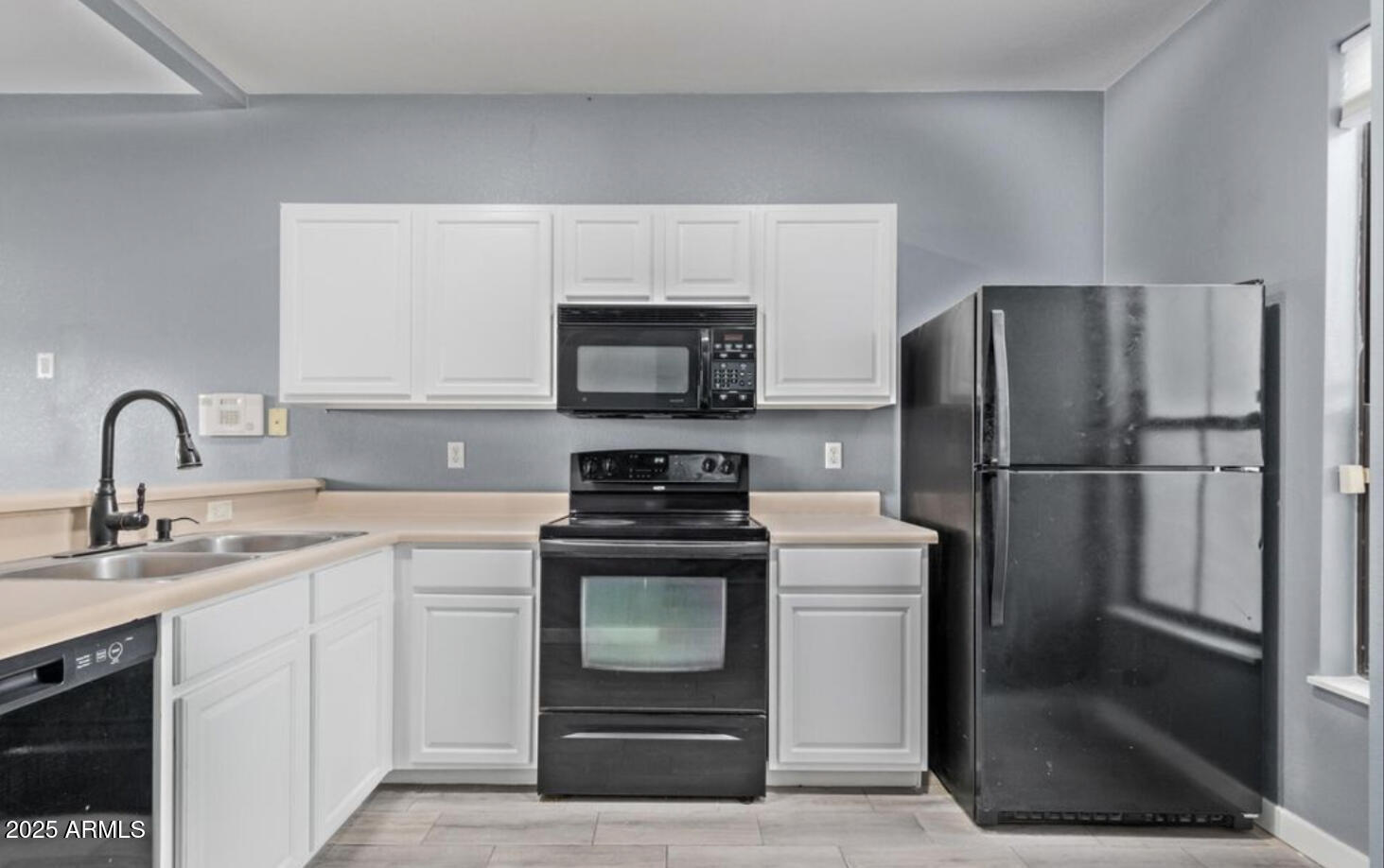 280 South Elizabeth Way, Unit 14 Chandler, AZ 85225 - Photo 22 of 26 a kitchen with a refrigerator sink and cabinets