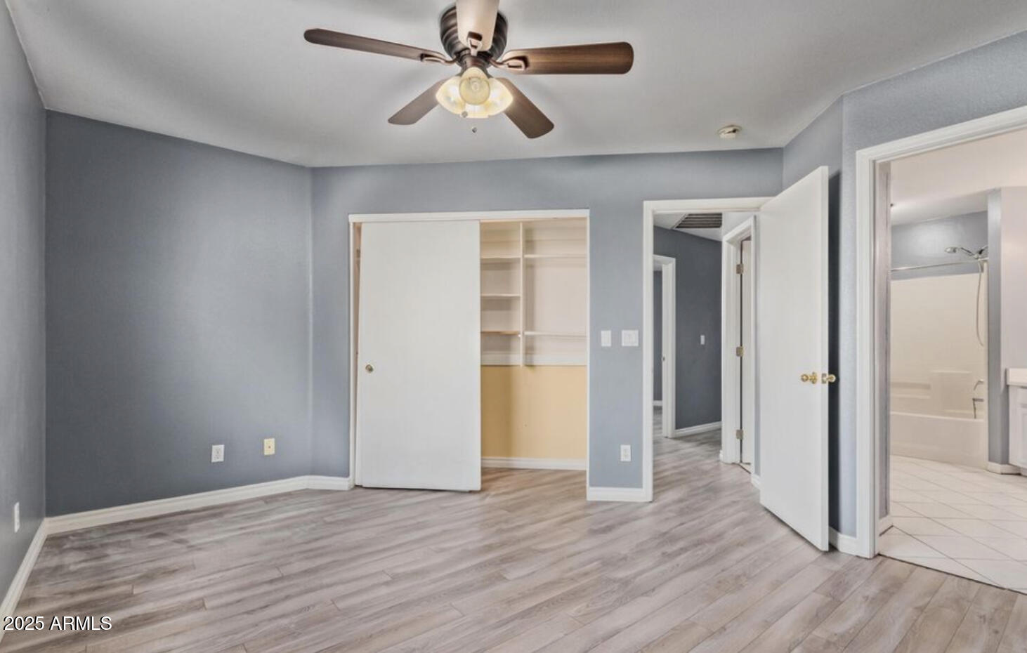 280 South Elizabeth Way, Unit 14 Chandler, AZ 85225 - Photo 24 of 26 wooden floor in an empty room with a window