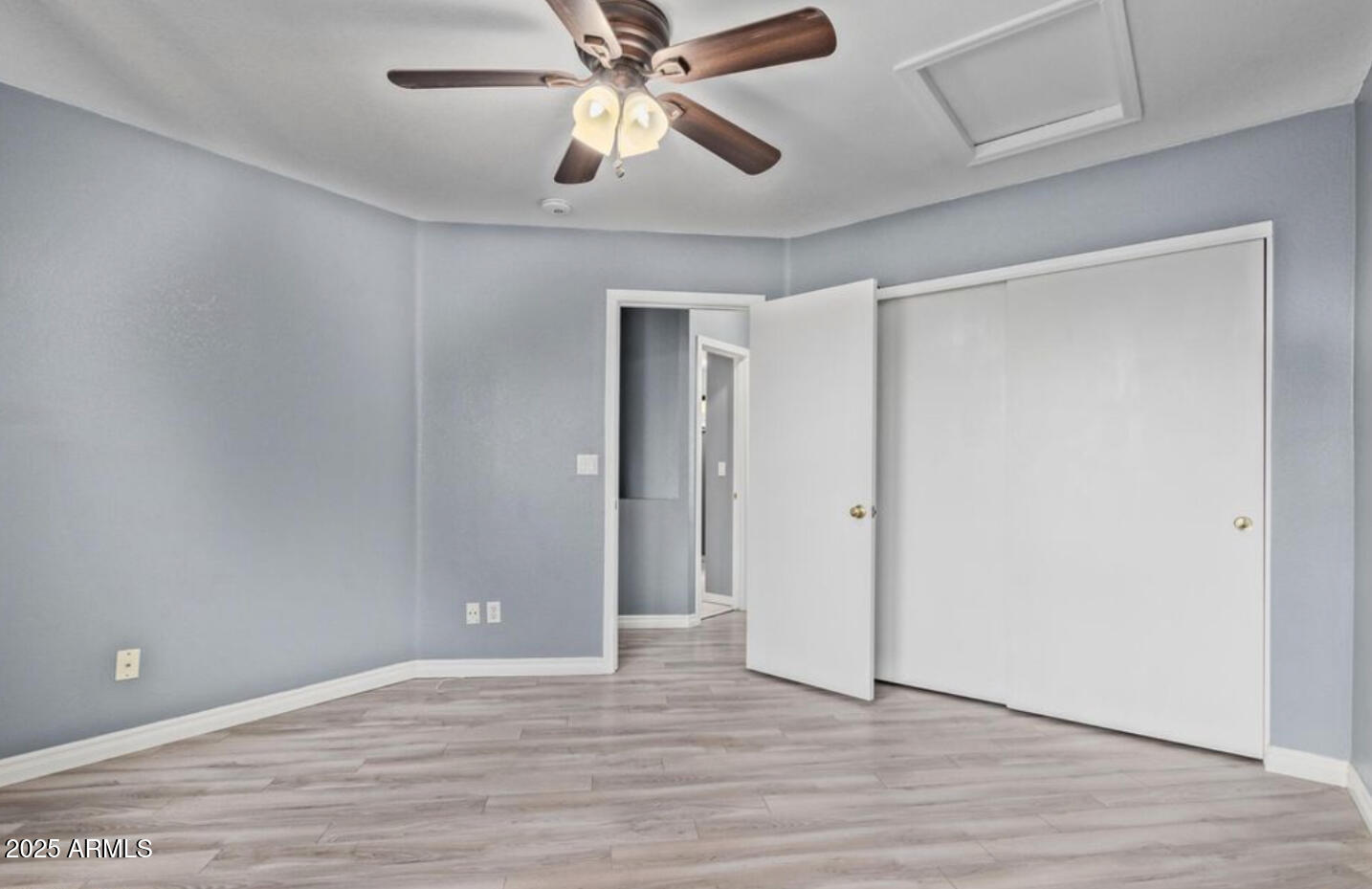 280 South Elizabeth Way, Unit 14 Chandler, AZ 85225 - Photo 4 of 26 a view of an empty room with wooden floor