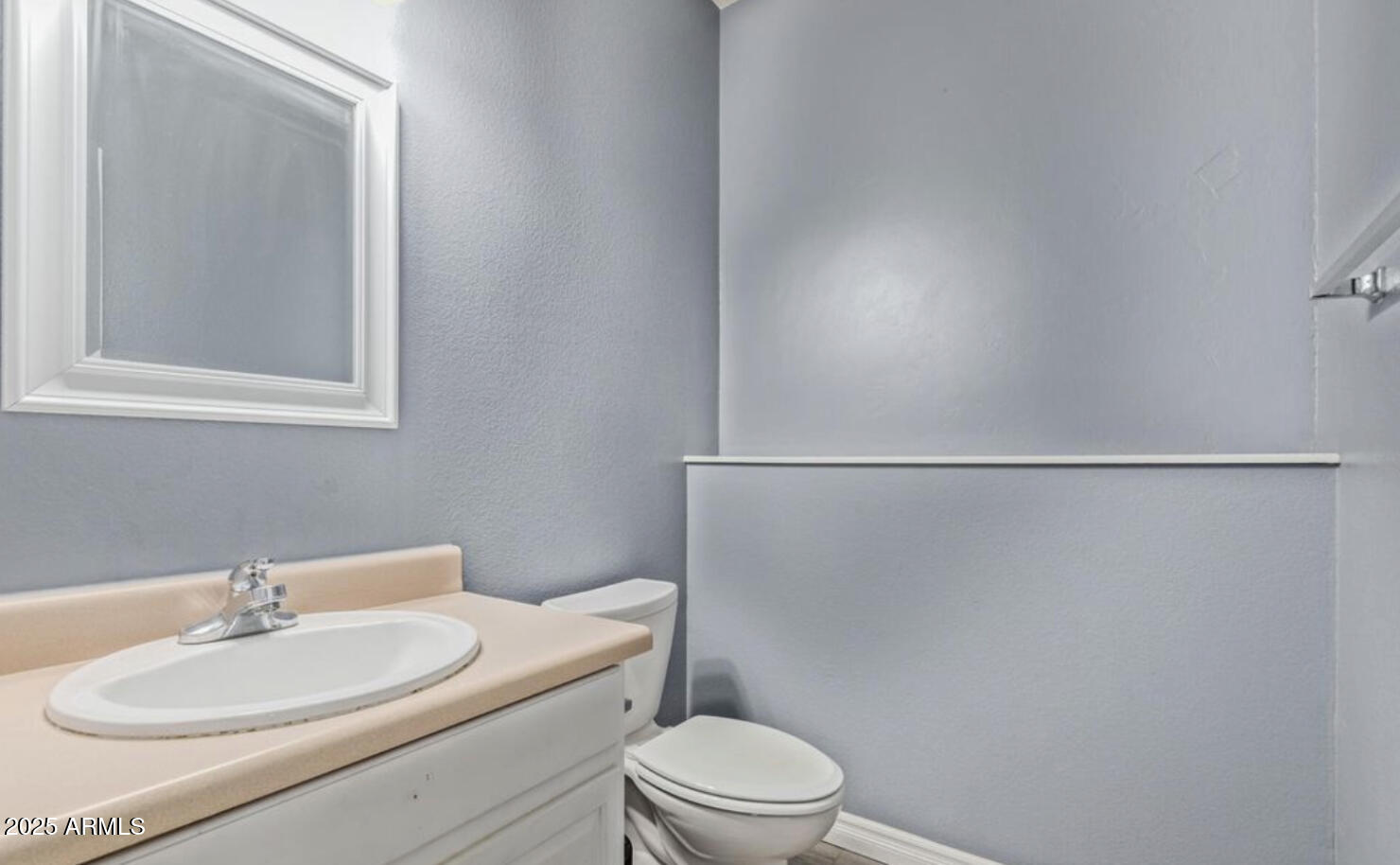 280 South Elizabeth Way, Unit 14 Chandler, AZ 85225 - Photo 10 of 26 a bathroom with a toilet a sink and mirror