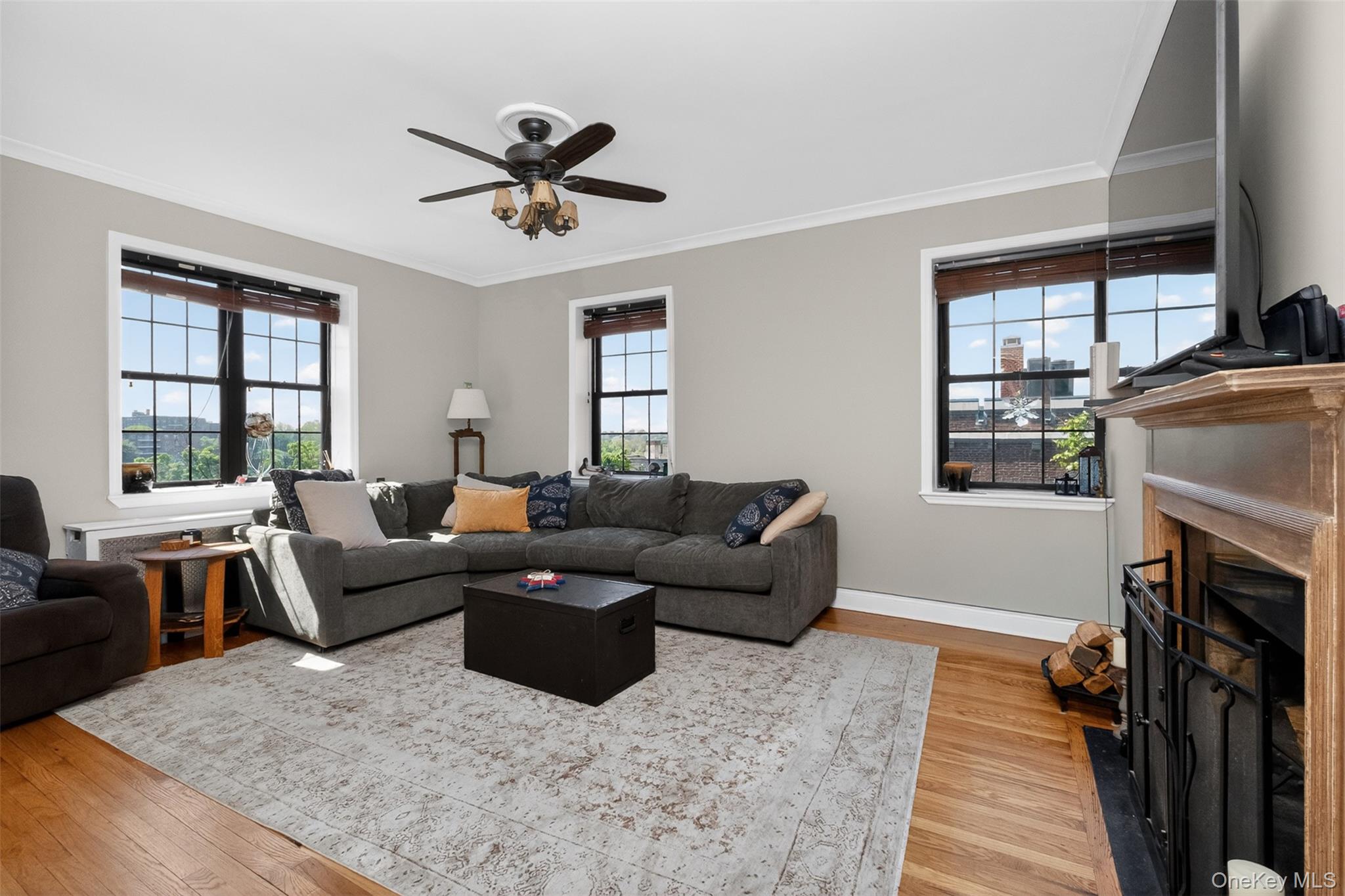 824 Bronx River Road, Unit 7C Bronxville, NY 10708 - Photo 1 of 13 a living room with furniture and a fireplace