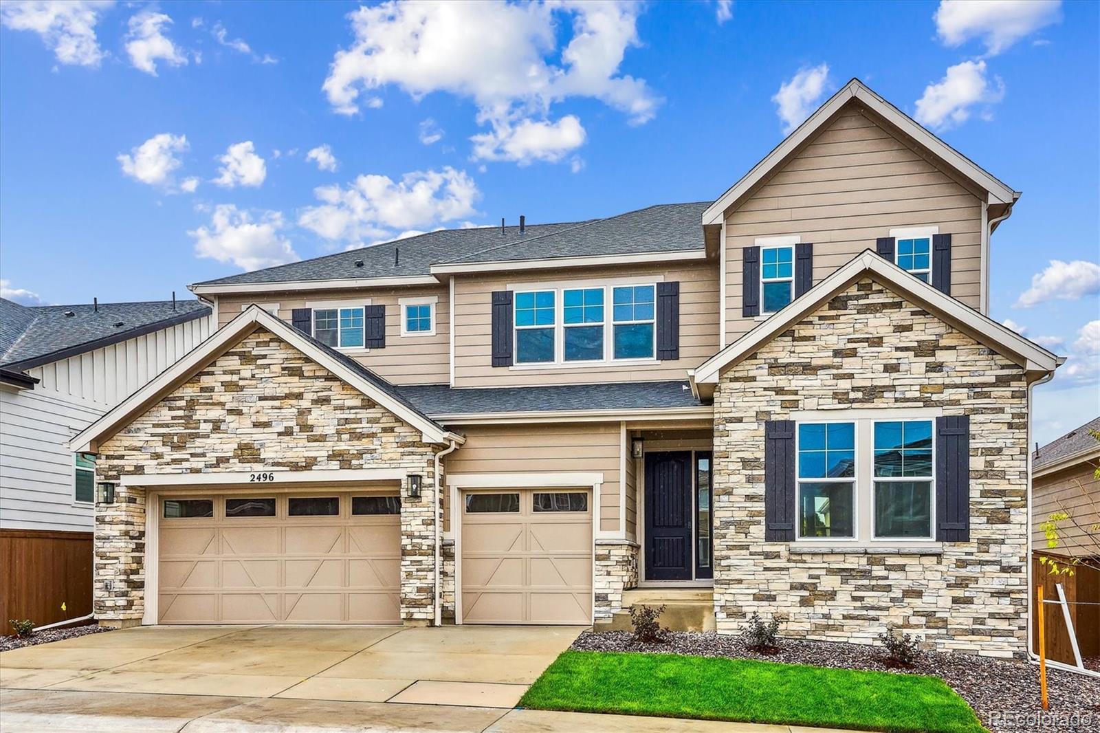 front view of a house with a yard