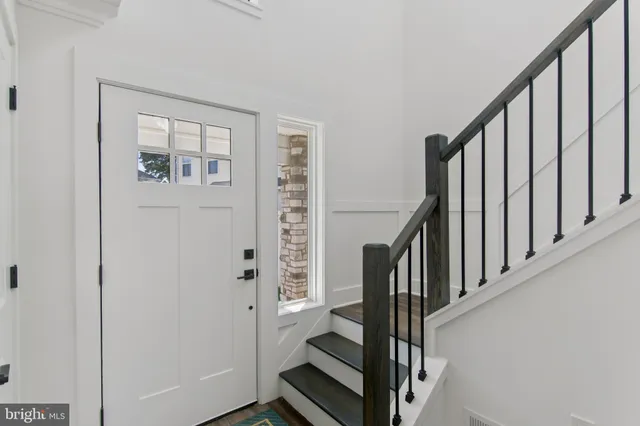 a view of entryway with wooden floor