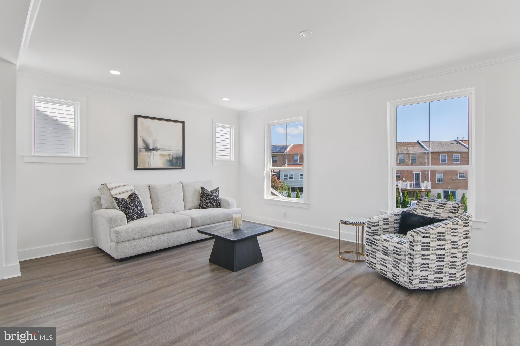 9838 Legion Street, Unit 3 Philadelphia, PA 19114 - Photo 21 of 51 a living room with furniture rug and window