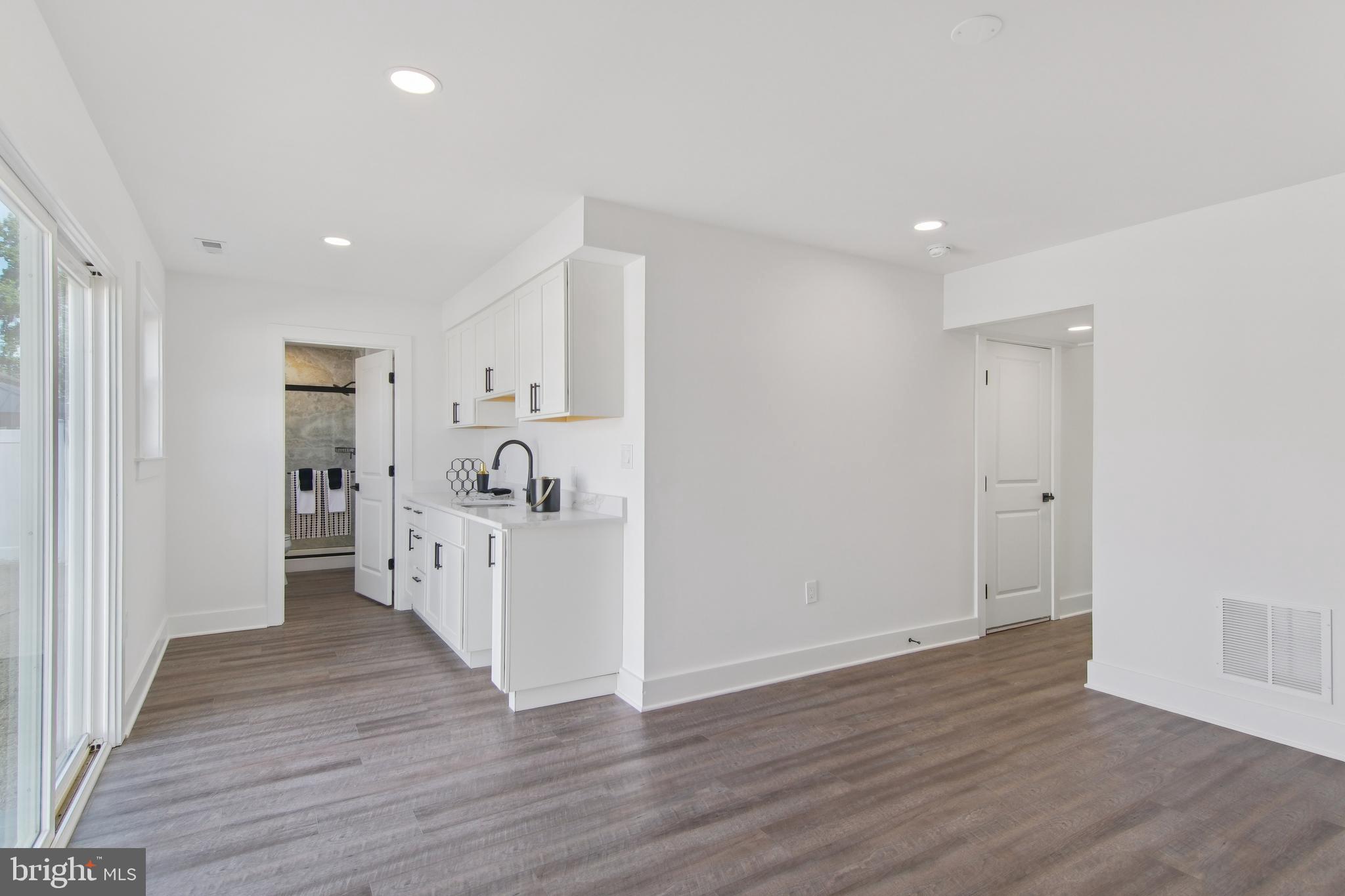 9838 Legion Street, Unit 3 Philadelphia, PA 19114 - Photo 28 of 51 a view of a hallway with wooden floor and staircase