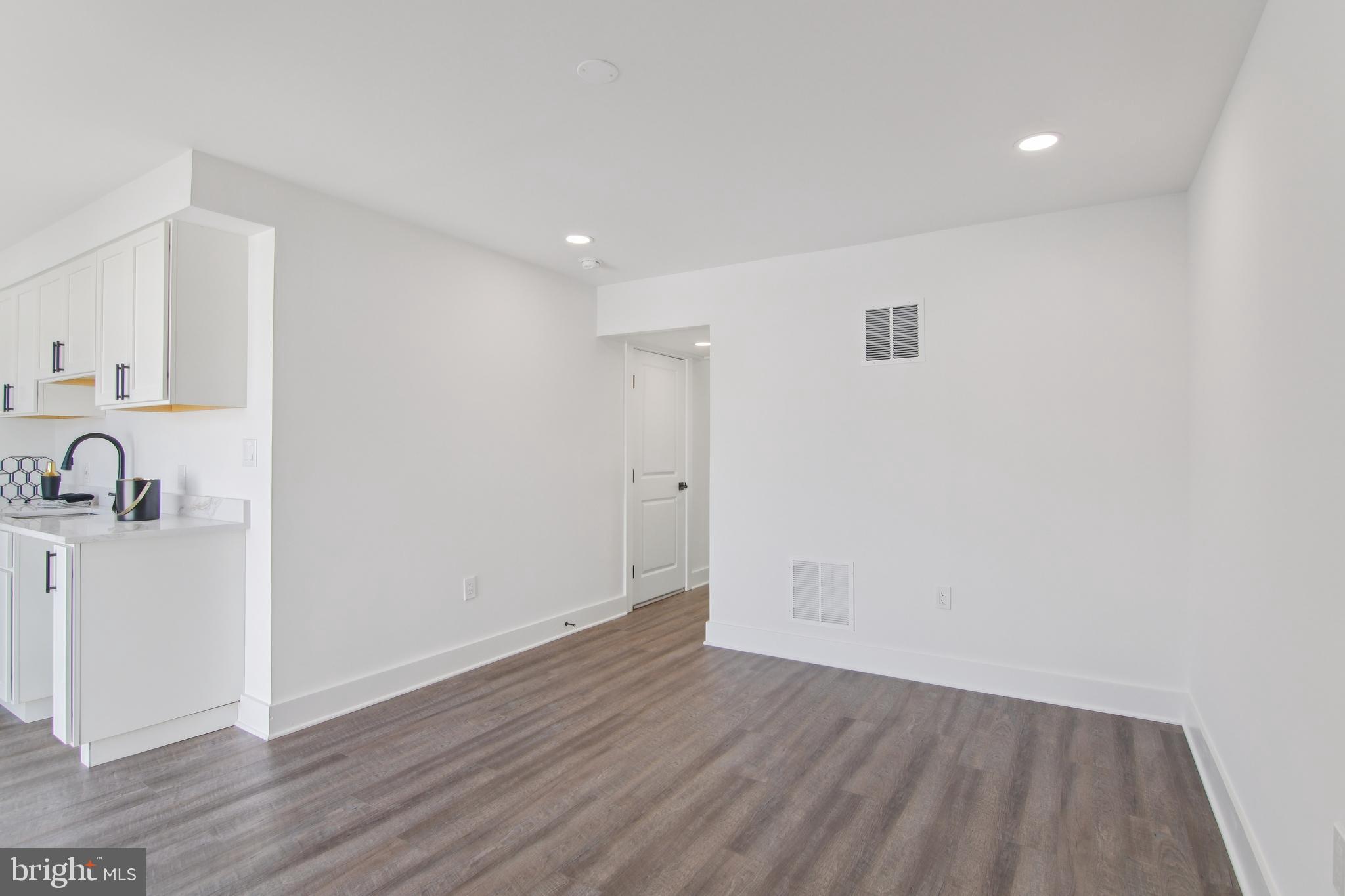 9838 Legion Street, Unit 3 Philadelphia, PA 19114 - Photo 29 of 51 a view of a livingroom with wooden floor