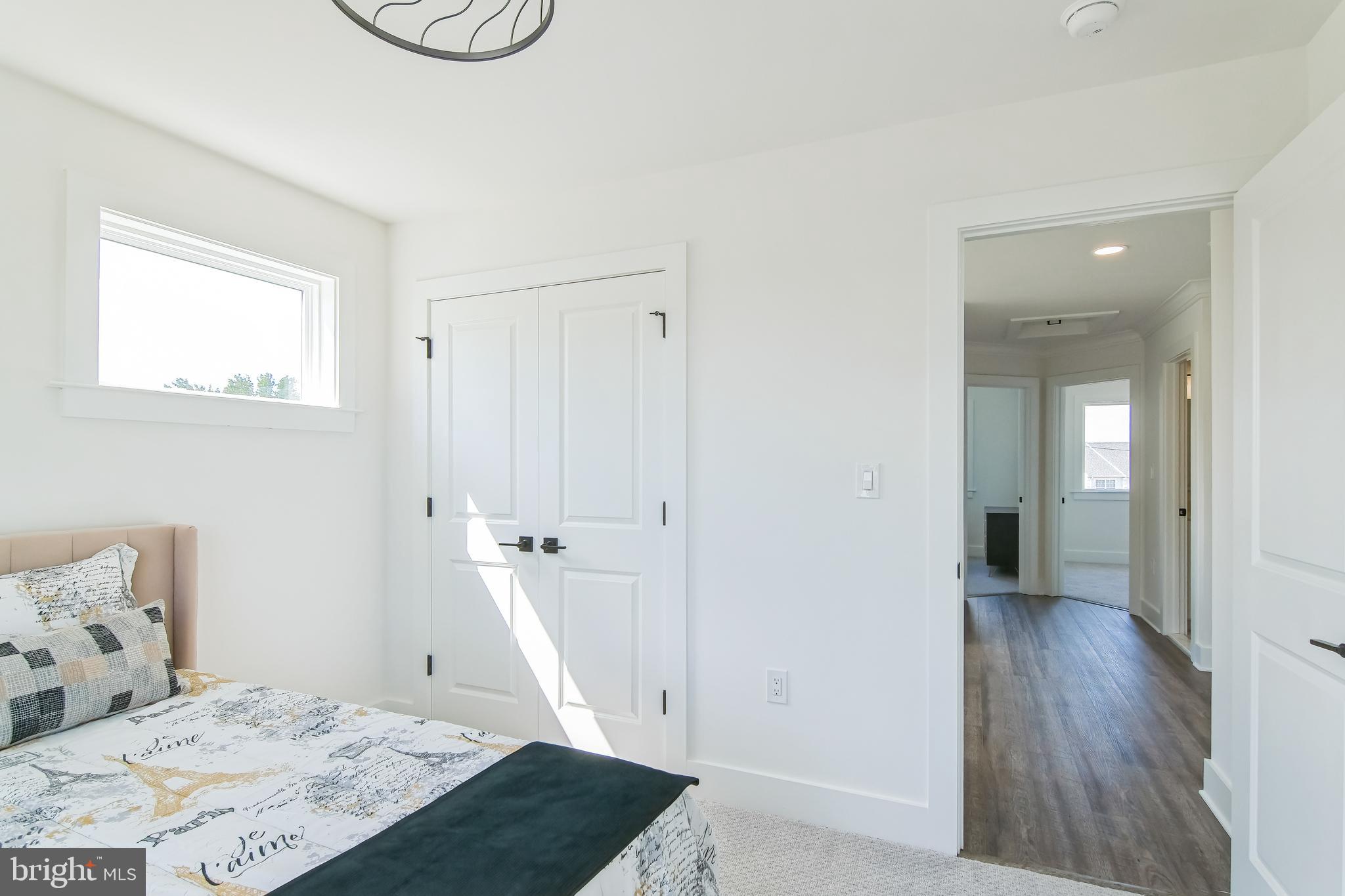 9838 Legion Street, Unit 3 Philadelphia, PA 19114 - Photo 45 of 51 a view of a bedroom with wooden floor and bedroom
