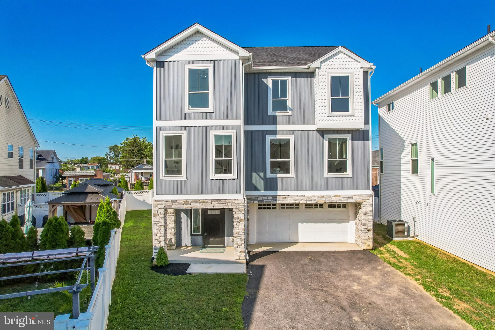 9838 Legion Street, Unit 3 Philadelphia, PA 19114 - Photo 8 of 51 a front view of a house with a yard